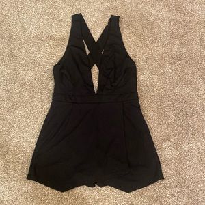 Windsor deep-V romper with cross back and faux wrap skirt
